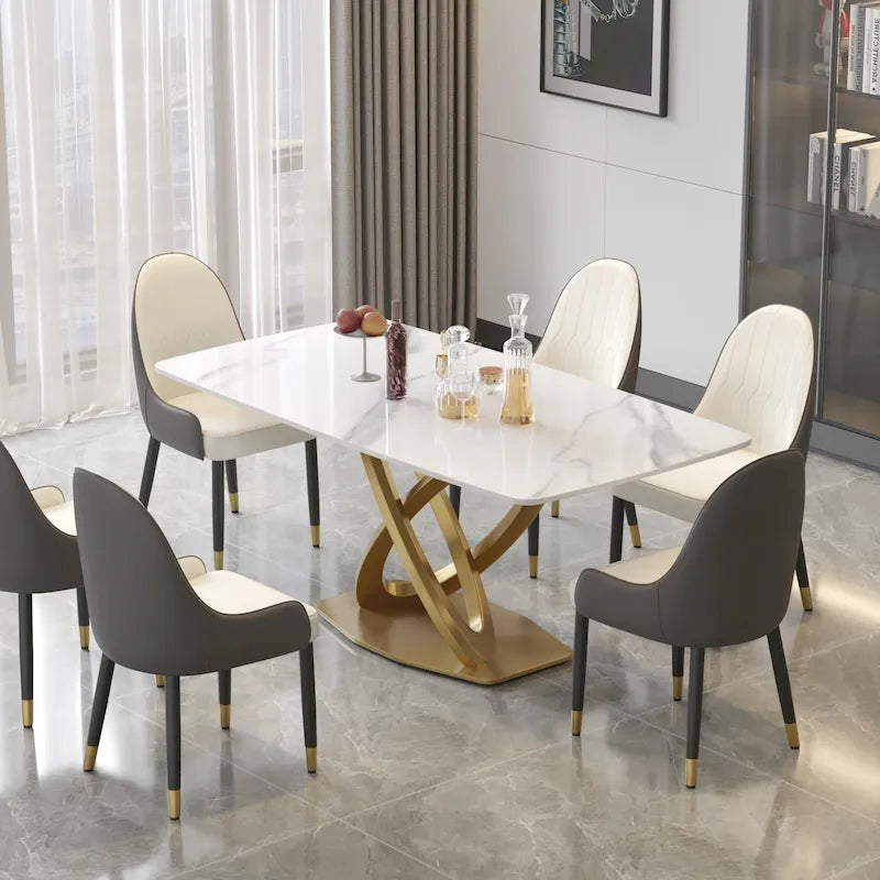 Table de salle à manger avec plateau rectangulaire en pierre frittée et piètement doré