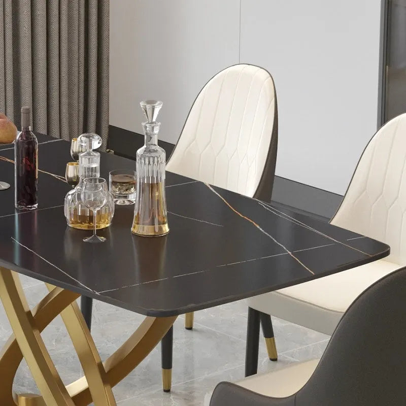 Table de salle à manger avec plateau rectangulaire en pierre frittée et piètement doré